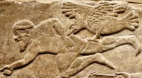 Vulture on Assyrian relief carving in Kalhu